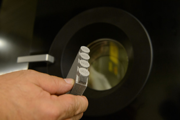 A titanium test specimen made at the Pratt & Whitney Additive Manufacturing Center at the University of Connecticut on June 26, 2013. (Peter Morenus/UConn Photo)