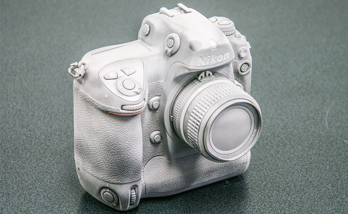 Camera covered in AESUB 3D scanning spray