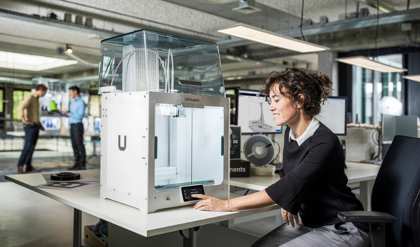 Woman using 3D printer