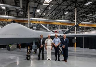 Image shows team standing near aircraft