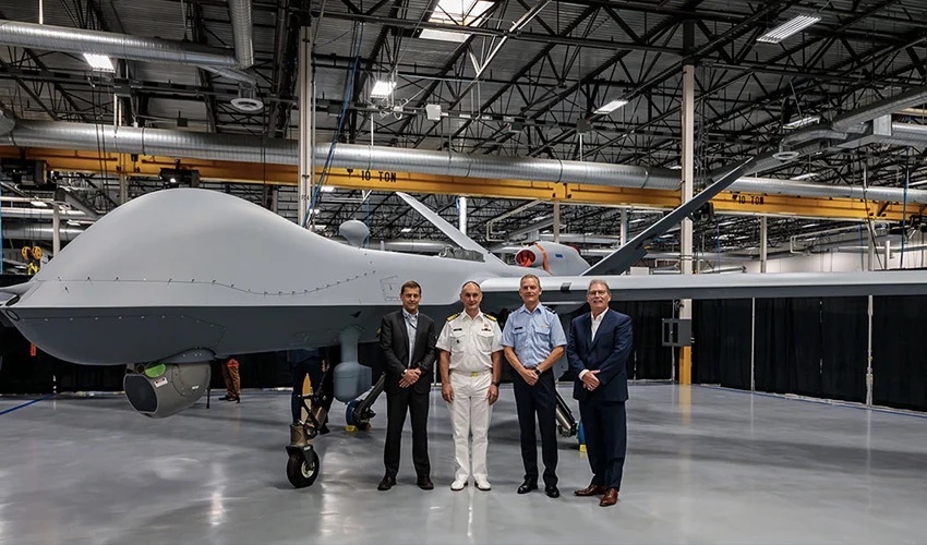 Image shows team standing near aircraft