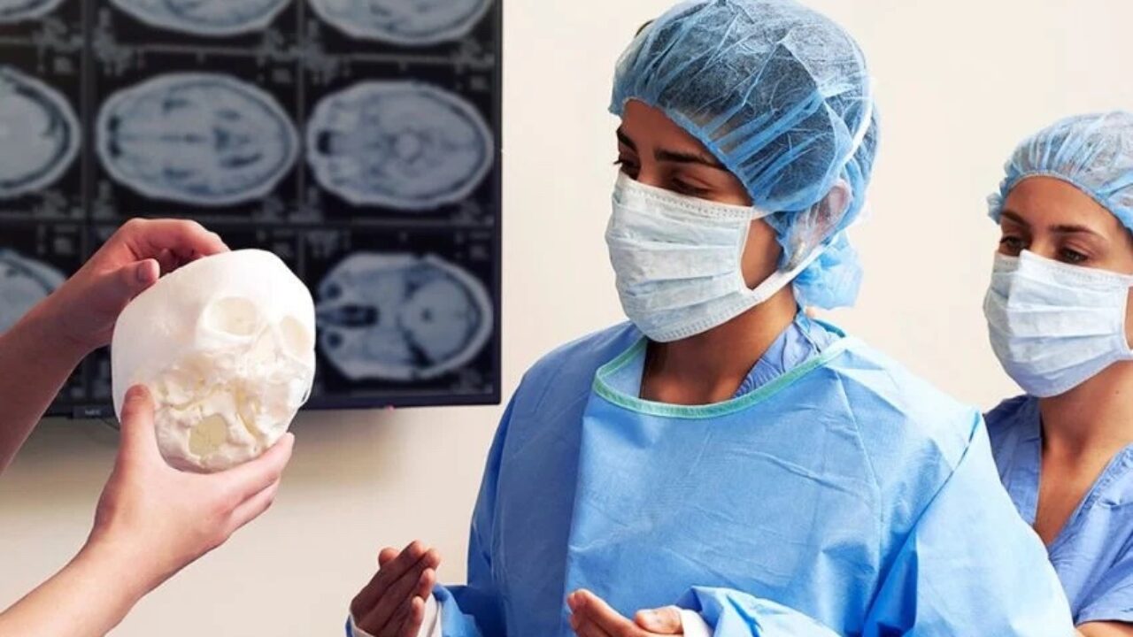 A large 3D printer running inside a hospital or clinical laboratory environment, showing its integration into medical facilities.