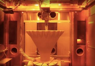 A view of the RAMFIRE rocket nozzle during 3D printing.