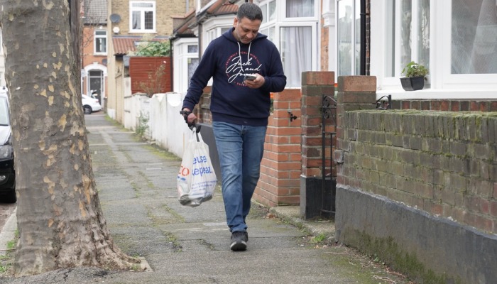 Suleman Chohan carries groceries with his Hero Gauntlet