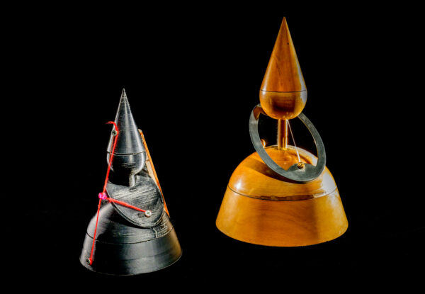 Student created version of Dandelin spheres [left] with original wooden model [right].