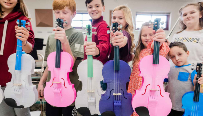 Students with 3D printed violins