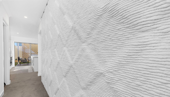 The project seeks to mesh the 3D printed walls with modern glazing and design elements.