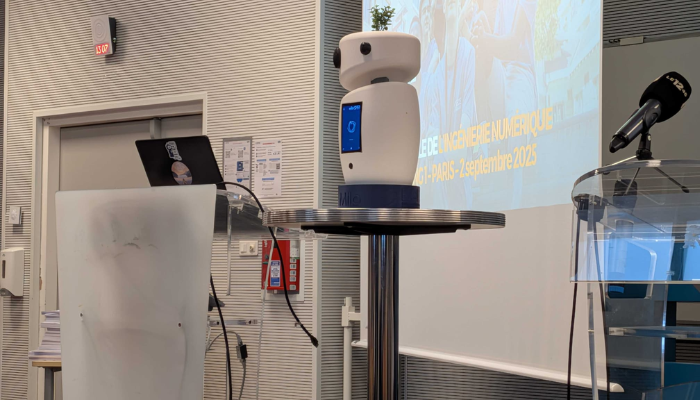Milo currently attends lectures with students and learns alongside them in the classroom. (Photo Credit: BFMTV)