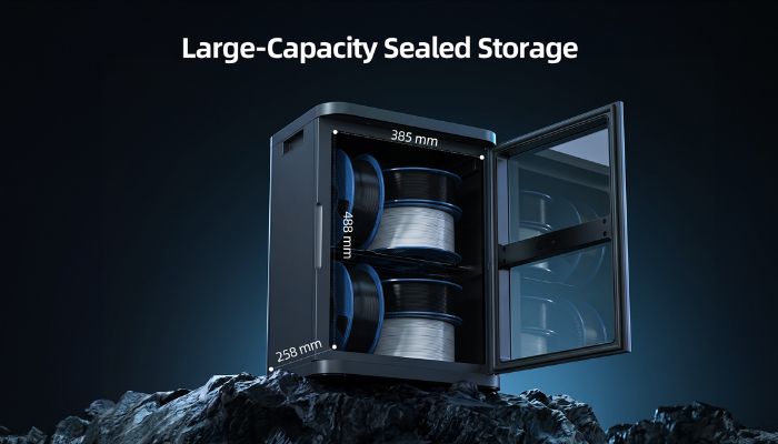 Render of the FilaDC i10 with its glass door open, showing filament spools on two internal shelves. Interior dimensions are marked: 385 mm wide, 258 mm deep and 488 mm high.