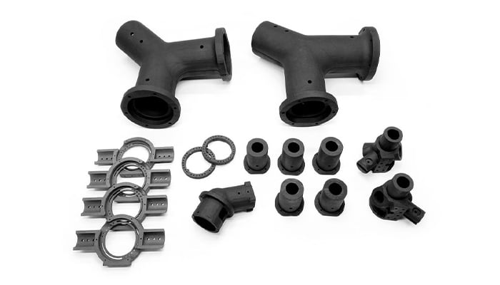 3D printed parts with PEEK and PA 12 in carbon fibers (Photo credits: Ricoh 3D)